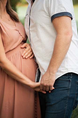 person man holding pregnant woman people