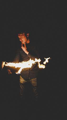 person man playing with fire people