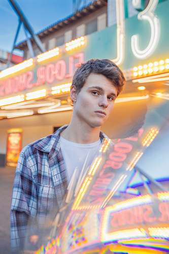 people man standing near neon signage person