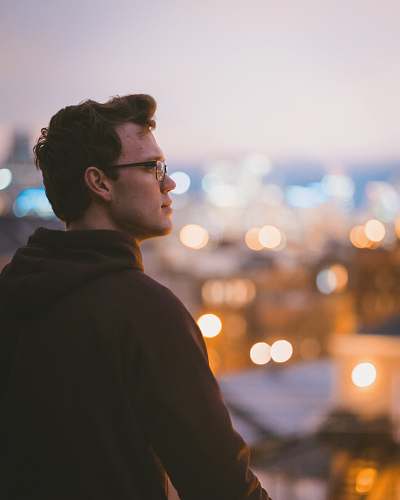 people man standing wearing black hoodie person