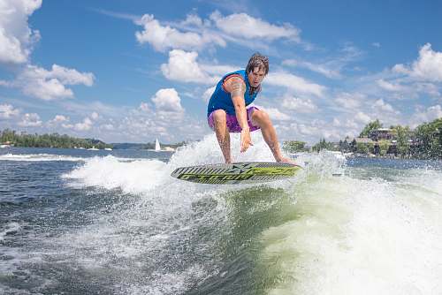 people man surfing during daytime person