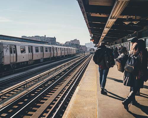 person man walking beside raillway train