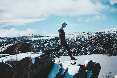 person man walking on the rocks people