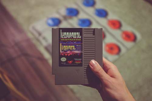 person Nintendo Jeopardy game cartridge advertisement
