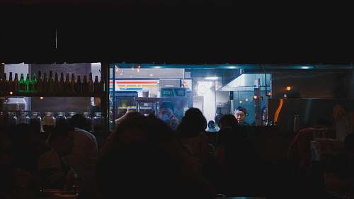 indoors people standing near blue lighted building during nighttime interior design