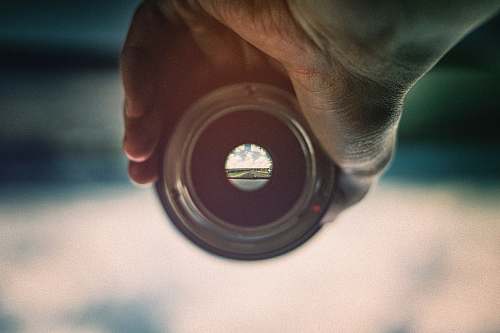 person person holding camera lens viewing mountains people