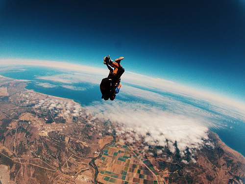person person skydiving on air during daytime people
