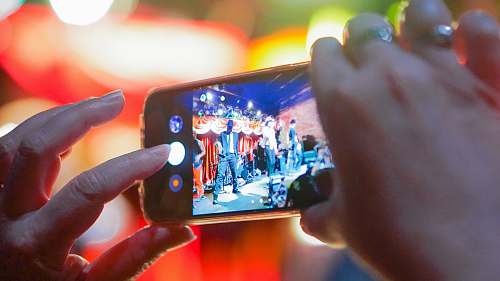 person person taking photo phone