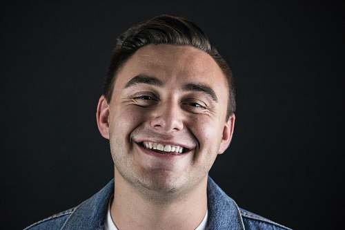 person smiling man wearing blue denim jacket people
