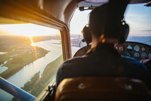 people view of helicopter cockpit on top of river person