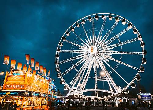 person white ferris wheel with lights amusement park