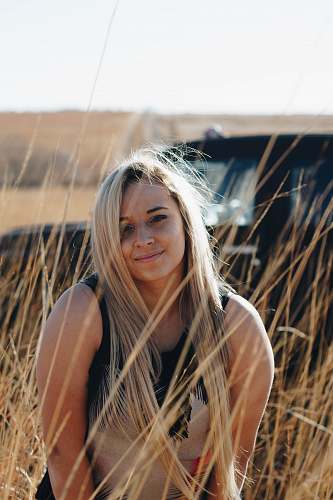 people woman in brown grass field posing person