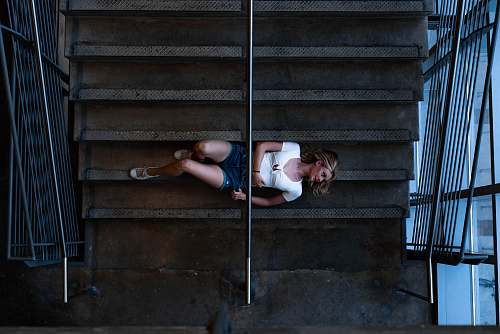 person woman lying on stairs people