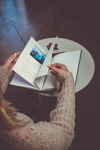 person woman reading a book people