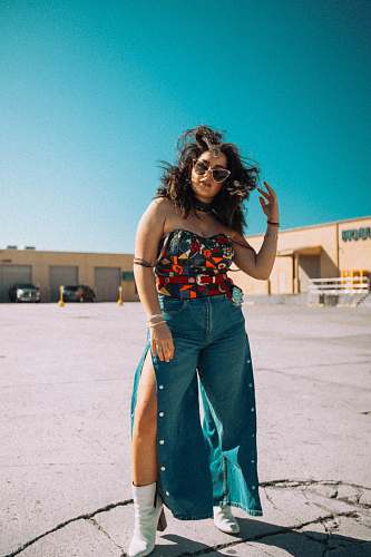 person woman standing at parking lot people
