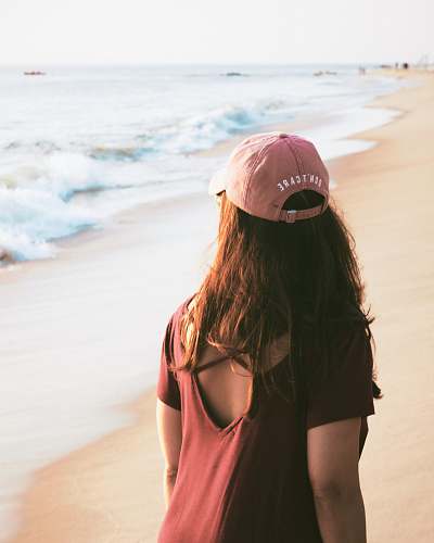apparel woman walking on sea shore clothing