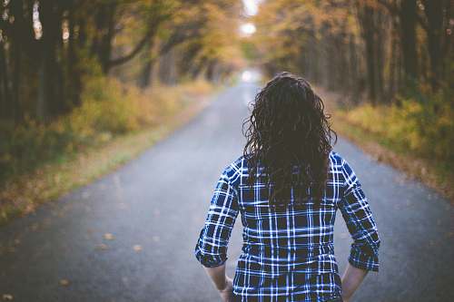 person woman walking on street people