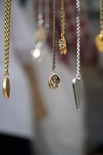 gold gold-and-silver-colored pendant necklace locket