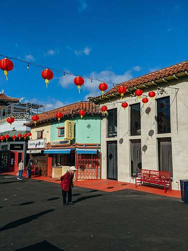 lamp woman walking during daytime chinatown