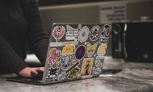 person person surfing black laptop near microwave oven neonbrand digital marketing