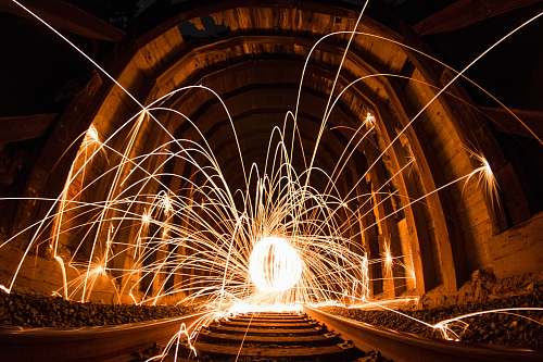 night steel wool photography between concrete wall ironwood