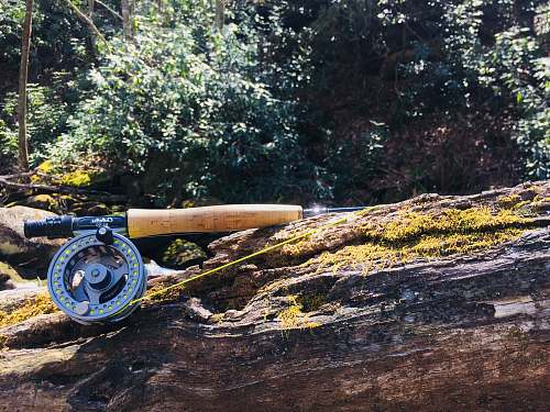 wheel brown and black fishing rod with fly reel s toe river rd