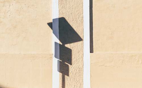 alphabet photo of signage shadow on wall text