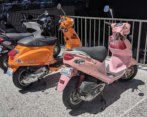 transportation parked pink motor scooter vehicle