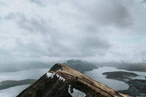 nature mountain under cloudy sky during daytime alps