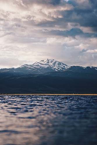 outdoors snow-covered mountain under cloudy sky snow