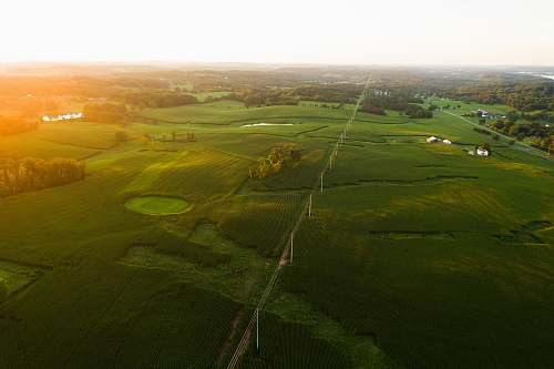 field aerial photography of green field countryside