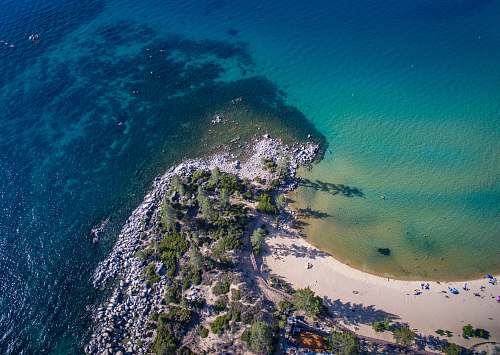 outdoors aerial view of green trees and body of water during daytime landscape