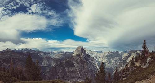 outdoors bird's eye view of mountain under white and blue sky mountain