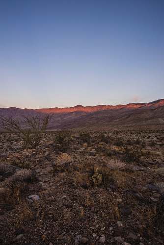 outdoors brown mountain under blue sky during daytime ground