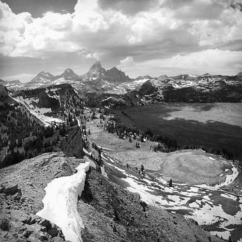 black-and-white greyscale photography of mountain hill cover with snow mountain