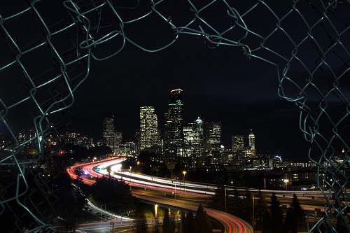 outdoors high rise building during nighttime road