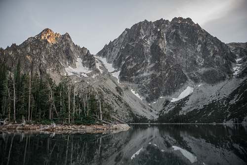 mountain lake near mountain outdoors