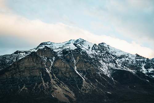 outdoors landscape photography of mountain covered with snow under the clear sky mountain