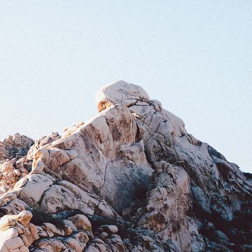 rock landscape photography of mountain cliff