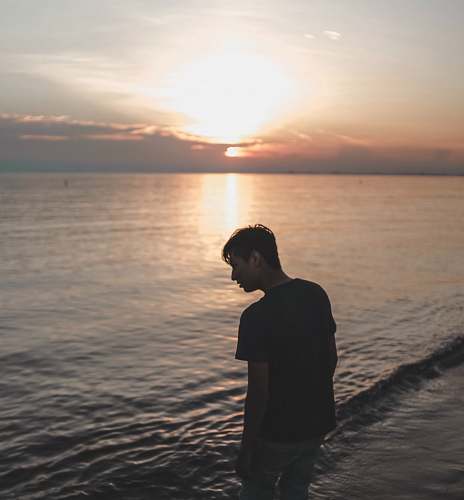 human man on beach outdoors