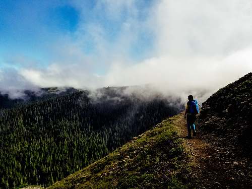 hiking man standing on mountain bald mountain