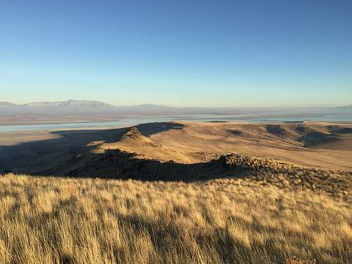 outdoors mountain and grassland under blue sky soil