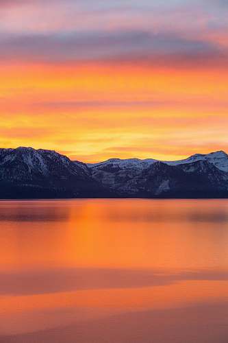 sunrise mountains and lake during sunset sunset