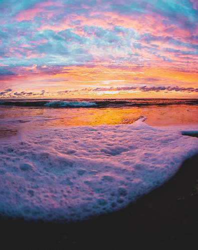 outdoors ocean waves crashing on shore during sunset ocean