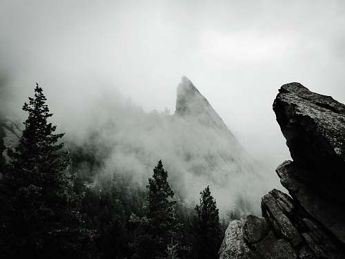 rock photo of fogged mountain range mountain
