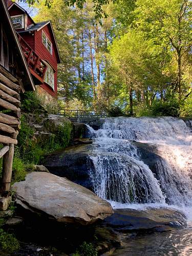 outdoors red wooden house river
