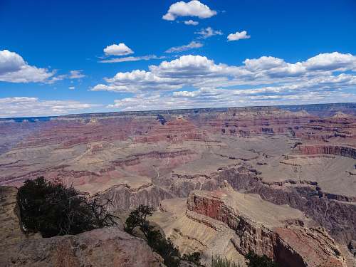outdoors rock formation under blue sky mountain