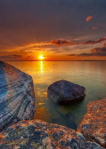 outdoors rock on ocean sunset