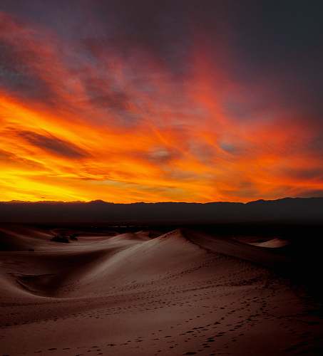 desert sunlight through clouds over mountain outdoors