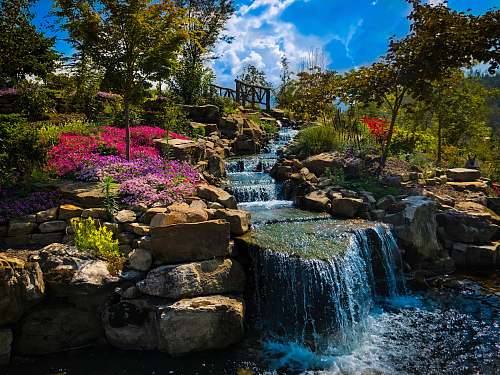 outdoors waterfall between trees water